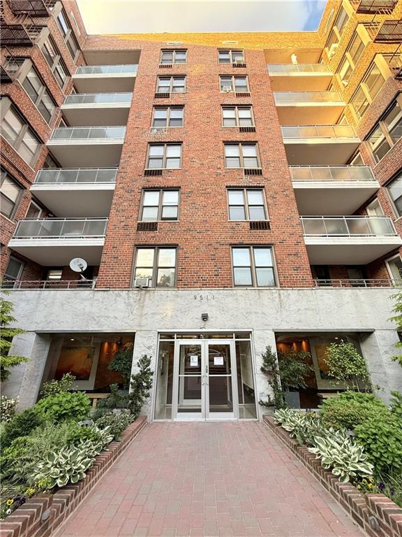 9511 Shore Road, Unit 617 Brooklyn, NY 11209 - Photo 13 of 14 a front view of a building with glass windows
