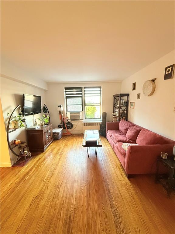 9511 Shore Road, Unit 617 Brooklyn, NY 11209 - Photo 5 of 14 a living room with furniture and a wooden floor