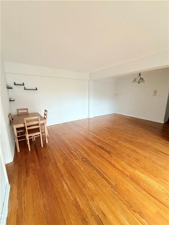 9511 Shore Road, Unit 617 Brooklyn, NY 11209 - Photo 6 of 14 a bedroom with a bed and cabinets