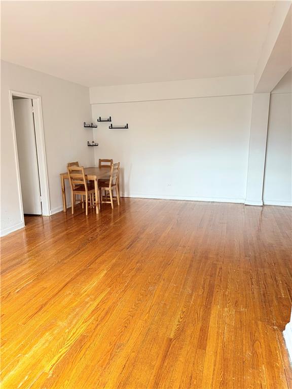 9511 Shore Road, Unit 617 Brooklyn, NY 11209 - Photo 8 of 14 a view of a room with wooden floor and a sink