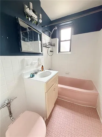 a kitchen with a stove a sink and a refrigerator