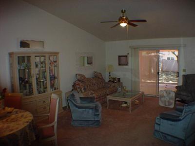 3559 West Sky Ridge Loop Tucson, AZ 85742 - Photo 5 of 9 a living room with furniture and a chandelier