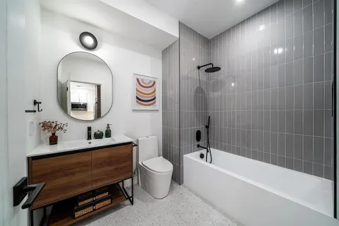 a bathroom with a toilet a sink and a bathtub