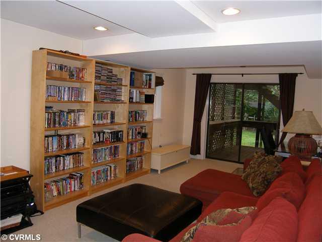 814 Watch Hill Road Midlothian, VA 23114 - Photo 11 of 12 Entertainment Room - Basement Recreation Room/Carpet/Recessed Lights/Sliding Glass Doors to Patio Underneath the Rear Deck
