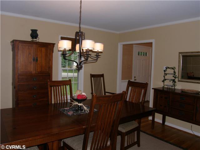 814 Watch Hill Road Midlothian, VA 23114 - Photo 4 of 12 Dining Room - Dining Room/Hardwood Floor/Crown Moulding/Chandelier