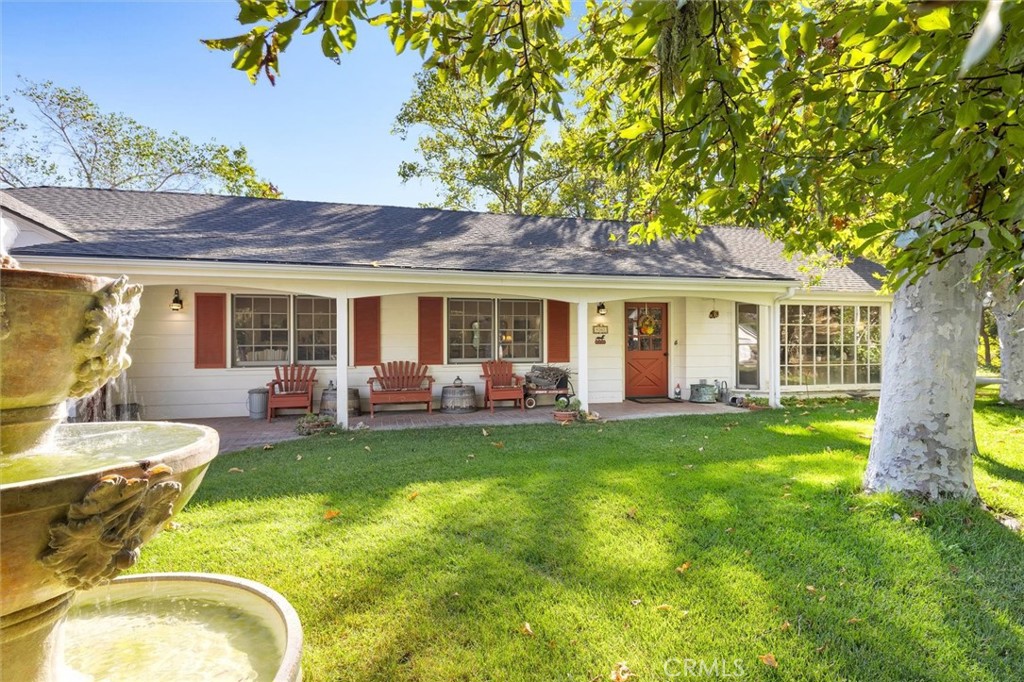 9160 Santa Barbara Road Atascadero, CA 93422 - Photo 1 of 1 All the charm with brick covered porch, shutters, and lush landscape.