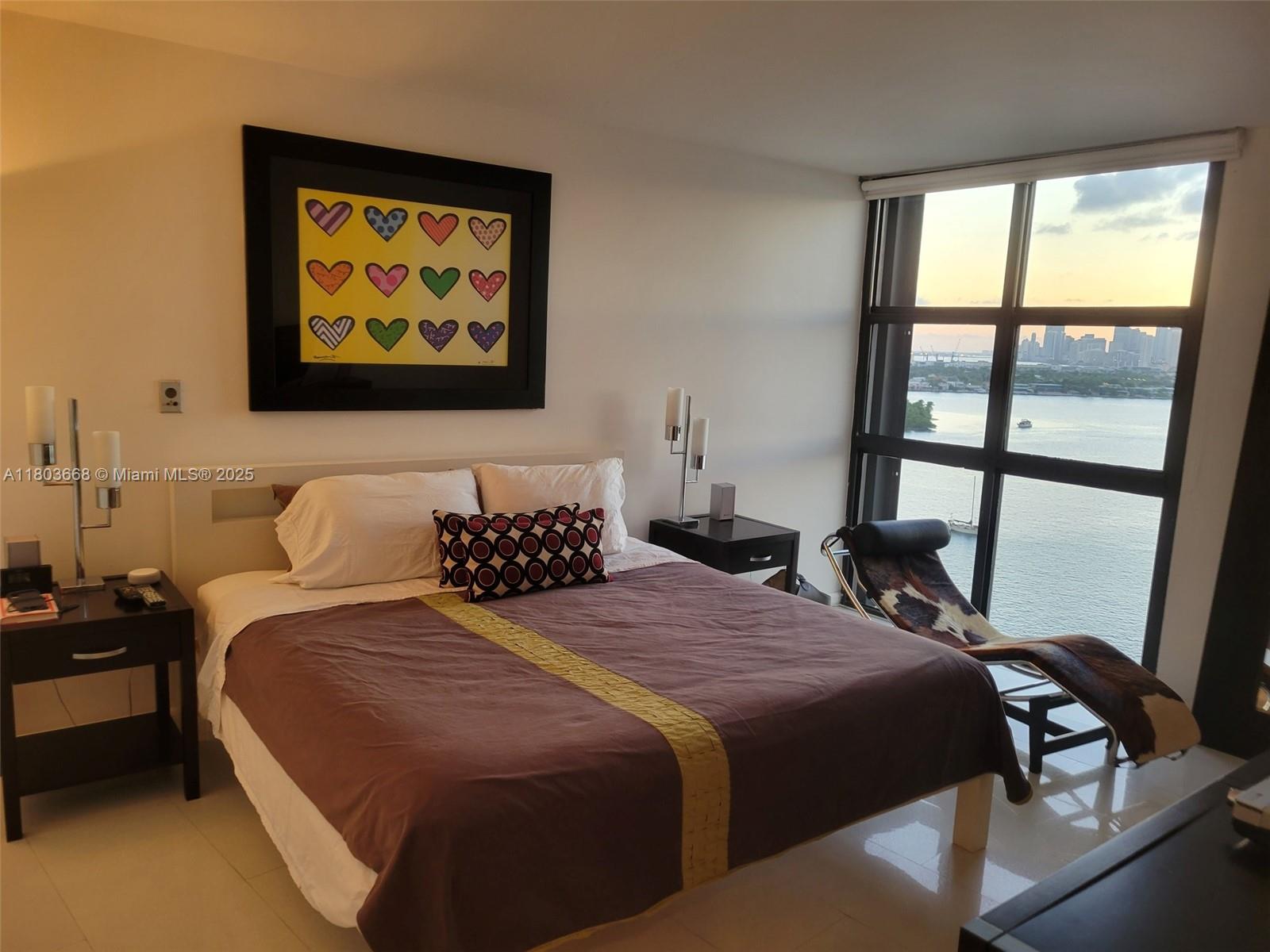 9 Island Avenue, Unit 1806 Miami Beach, FL 33139 - Photo 8 of 21 a bedroom with bed and a window