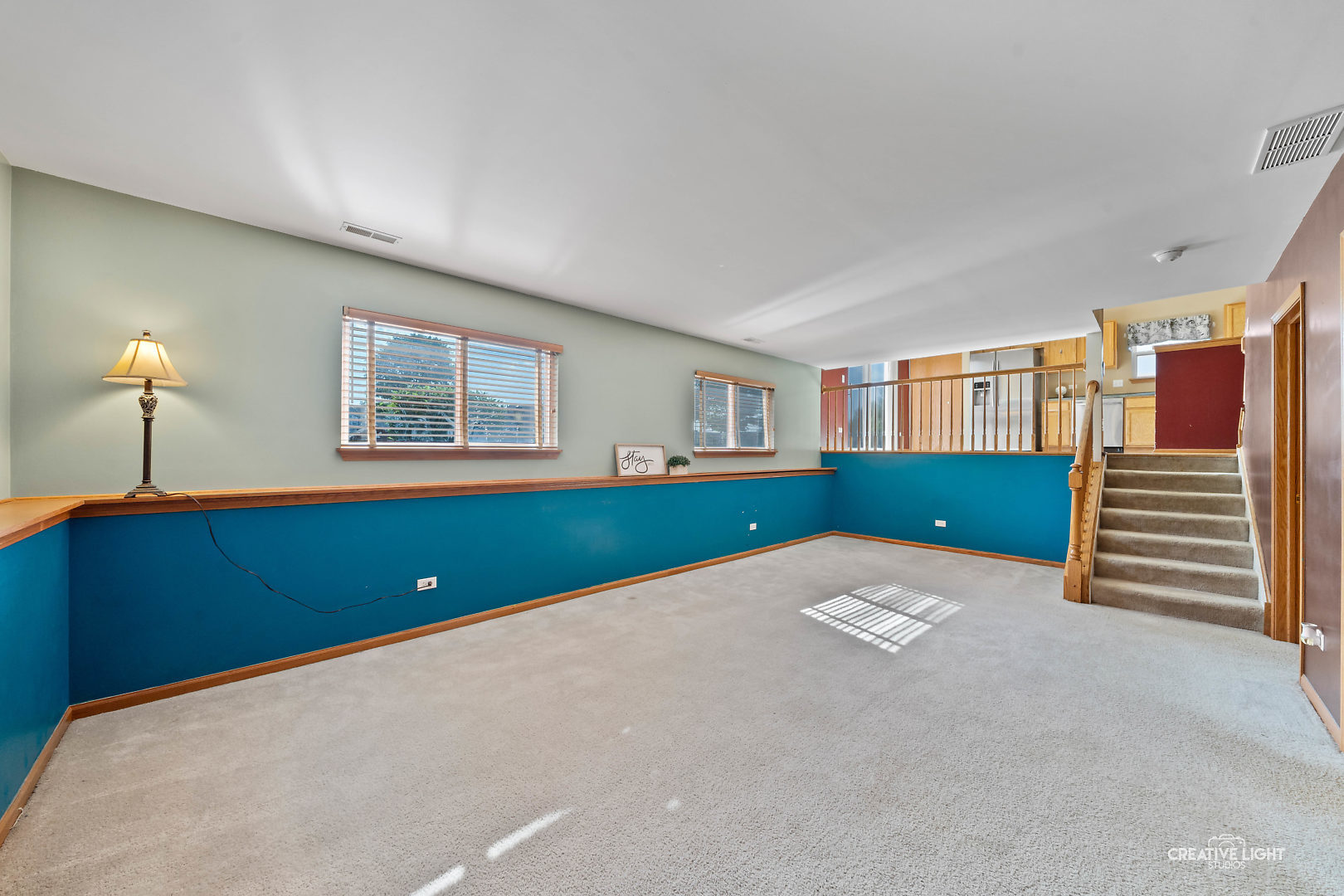 2113 Beldon Court Plainfield, IL 60586 - Photo 14 of 25 a view of an empty room with a window and a kitchen