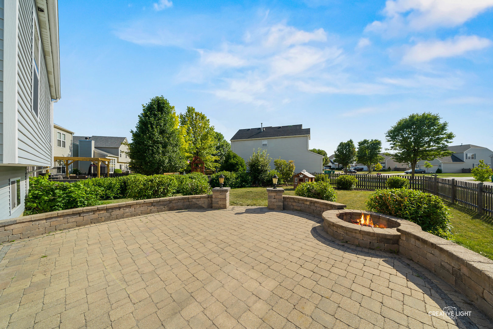 2113 Beldon Court Plainfield, IL 60586 - Photo 20 of 25 a view of a patio with couches and a table and chairs with wooden fence