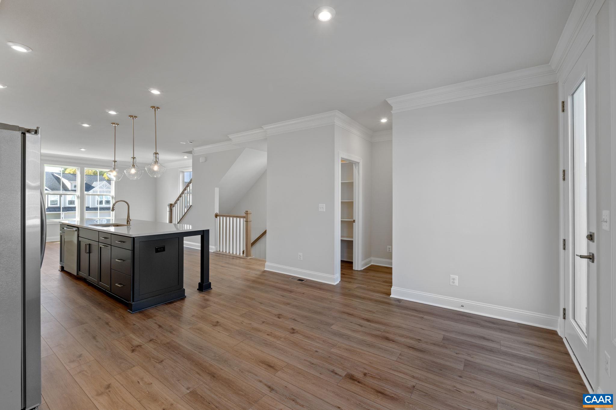 7 Ryan Way Charlottesville, VA 22911 - Photo 14 of 36 a view of an empty room with wooden floor and windows