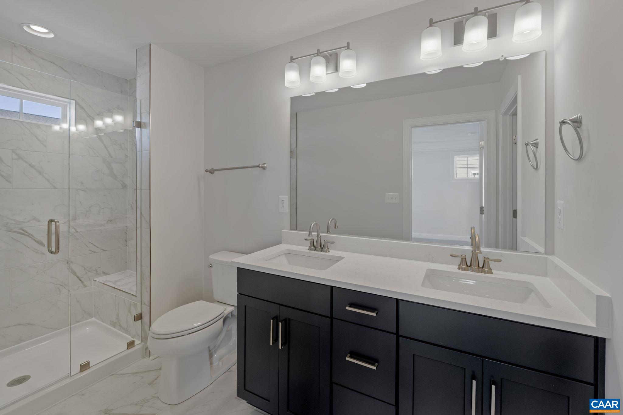 7 Ryan Way Charlottesville, VA 22911 - Photo 22 of 36 a bathroom with a sink a toilet and shower