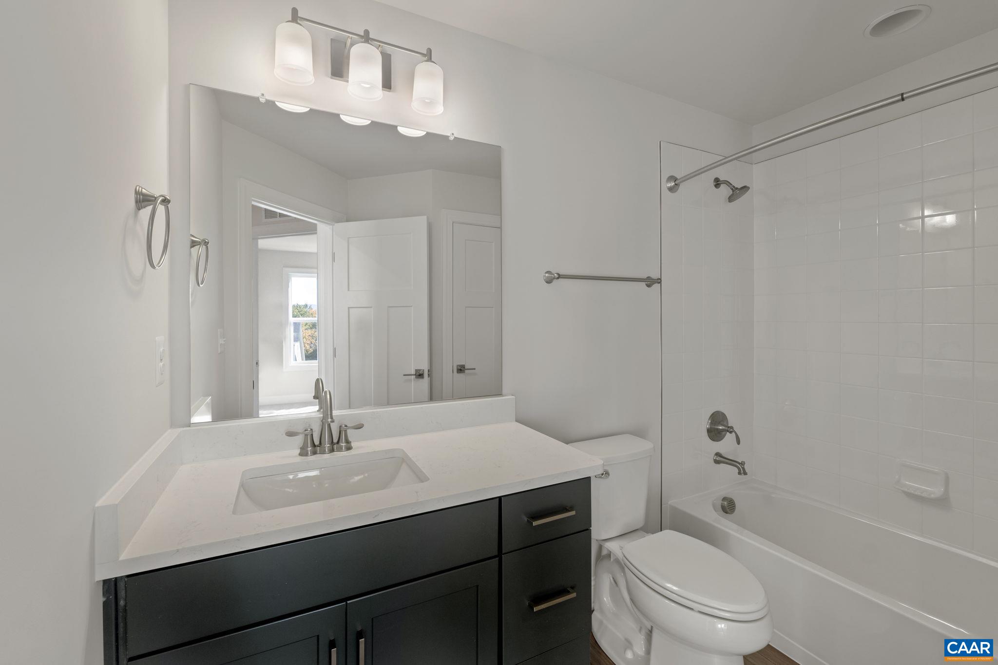 7 Ryan Way Charlottesville, VA 22911 - Photo 28 of 36 a bathroom with a sink a toilet and shower