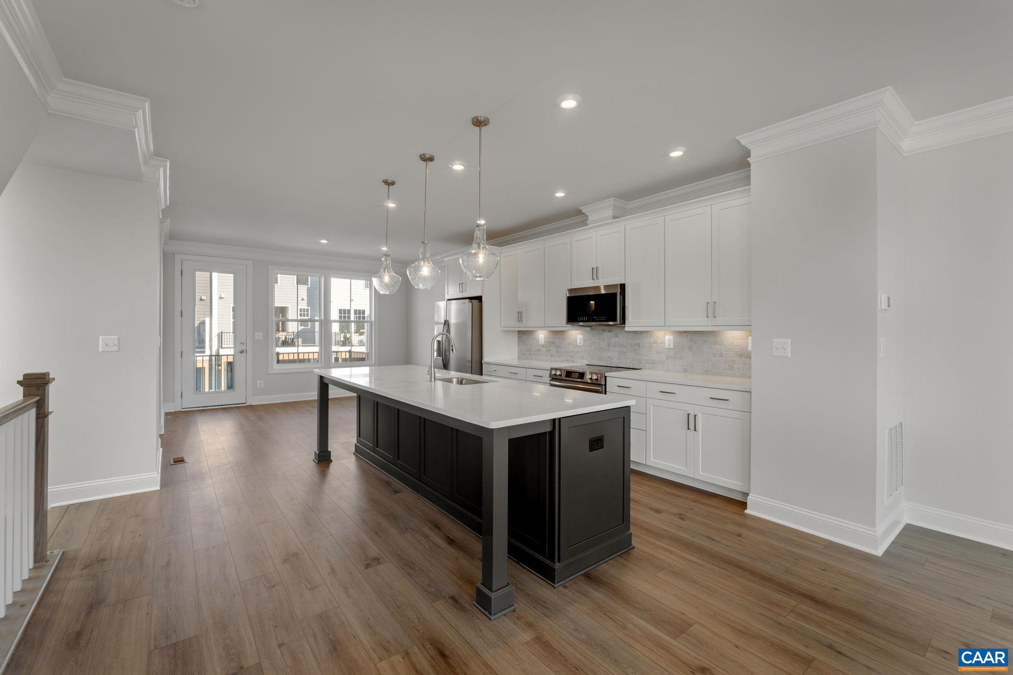 7 Ryan Way Charlottesville, VA 22911 - Photo 9 of 36 a kitchen with stainless steel appliances granite countertop a stove and a wooden floors