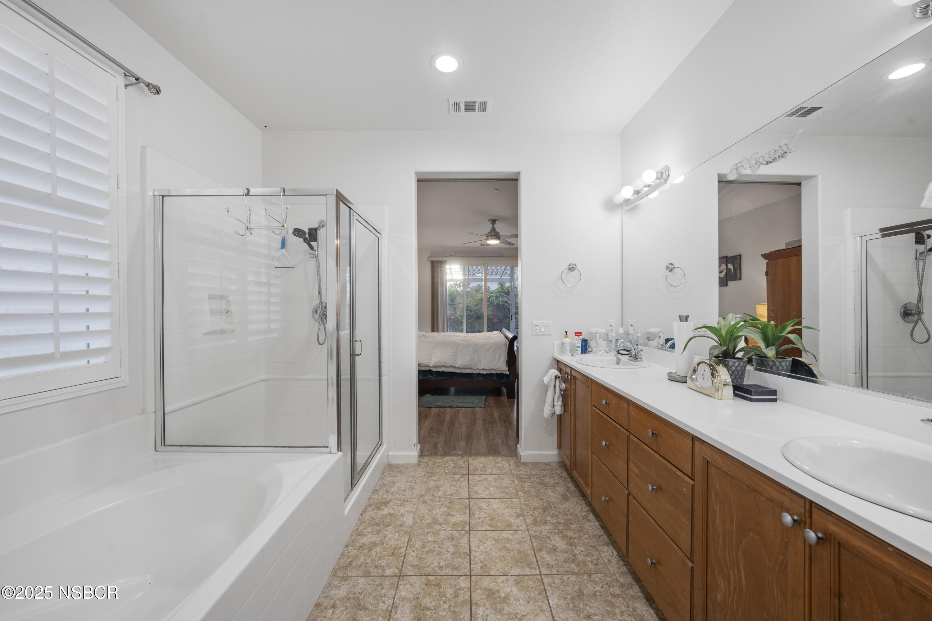 1033 Conception Drive Lompoc, CA 93436 - Photo 11 of 18 a bathroom with a double vanity sink and shower