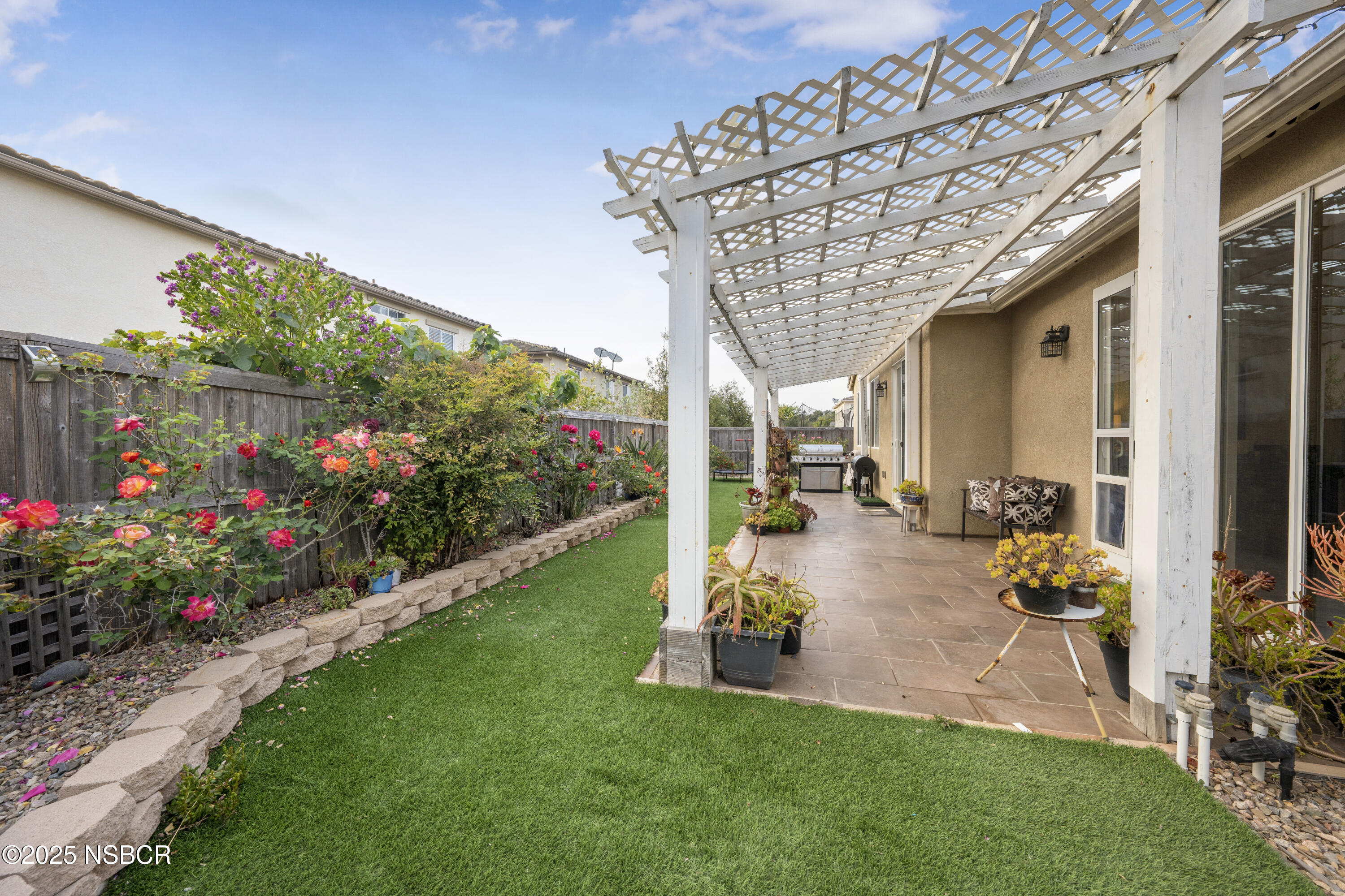 1033 Conception Drive Lompoc, CA 93436 - Photo 15 of 18 a view of a patio with table and chairs and potted plants