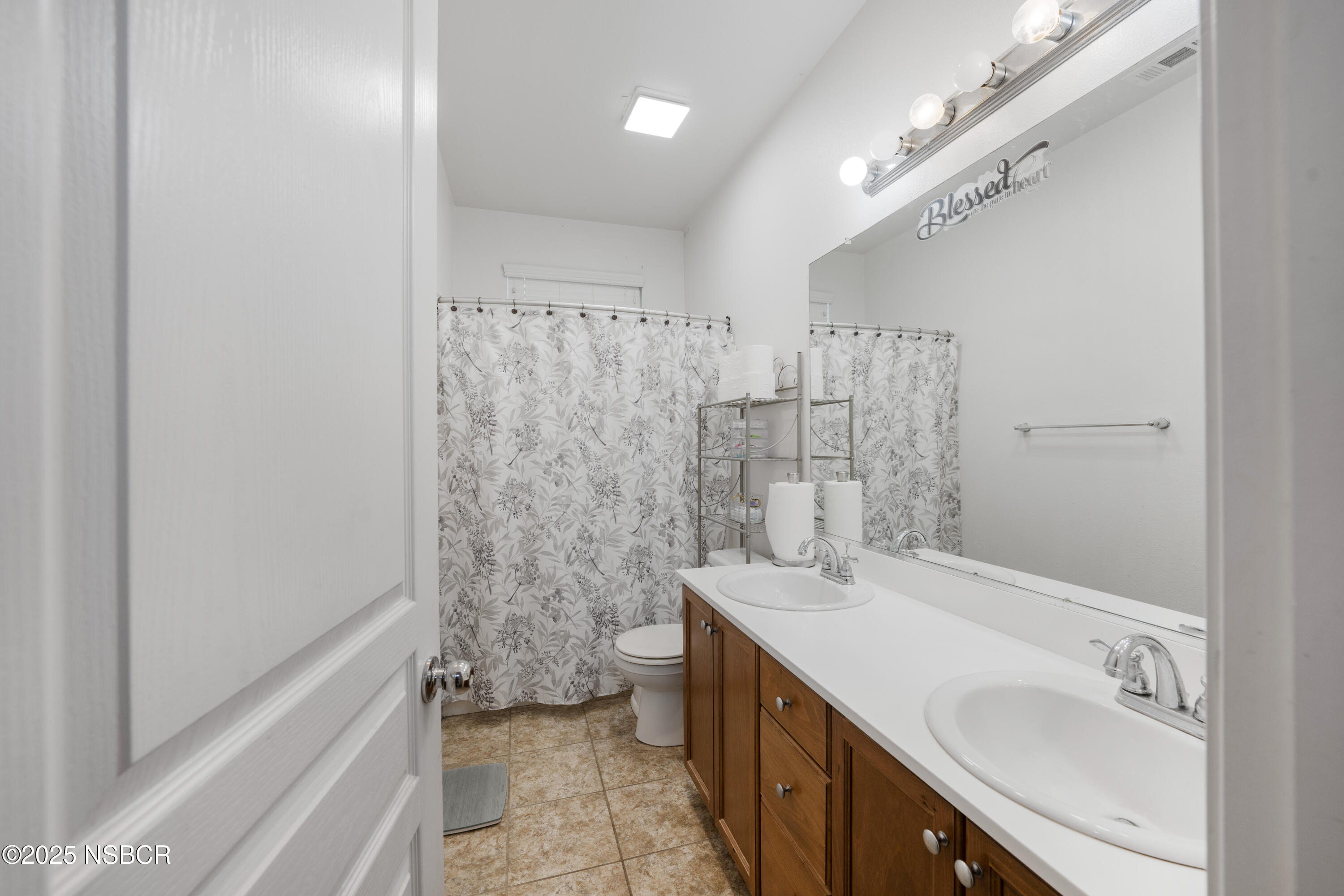 1033 Conception Drive Lompoc, CA 93436 - Photo 9 of 18 a bathroom with a sink a toilet and shower