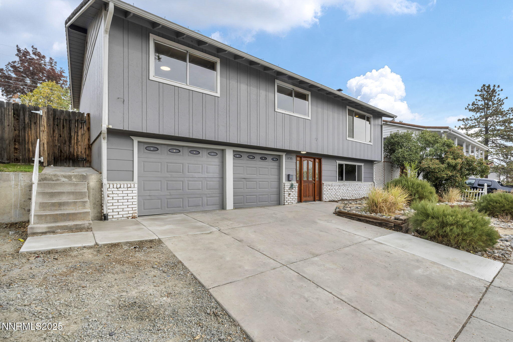 1735 Carlin Street Reno, NV 89503 - Photo 1 of 73 a front view of a house with a yard and garage