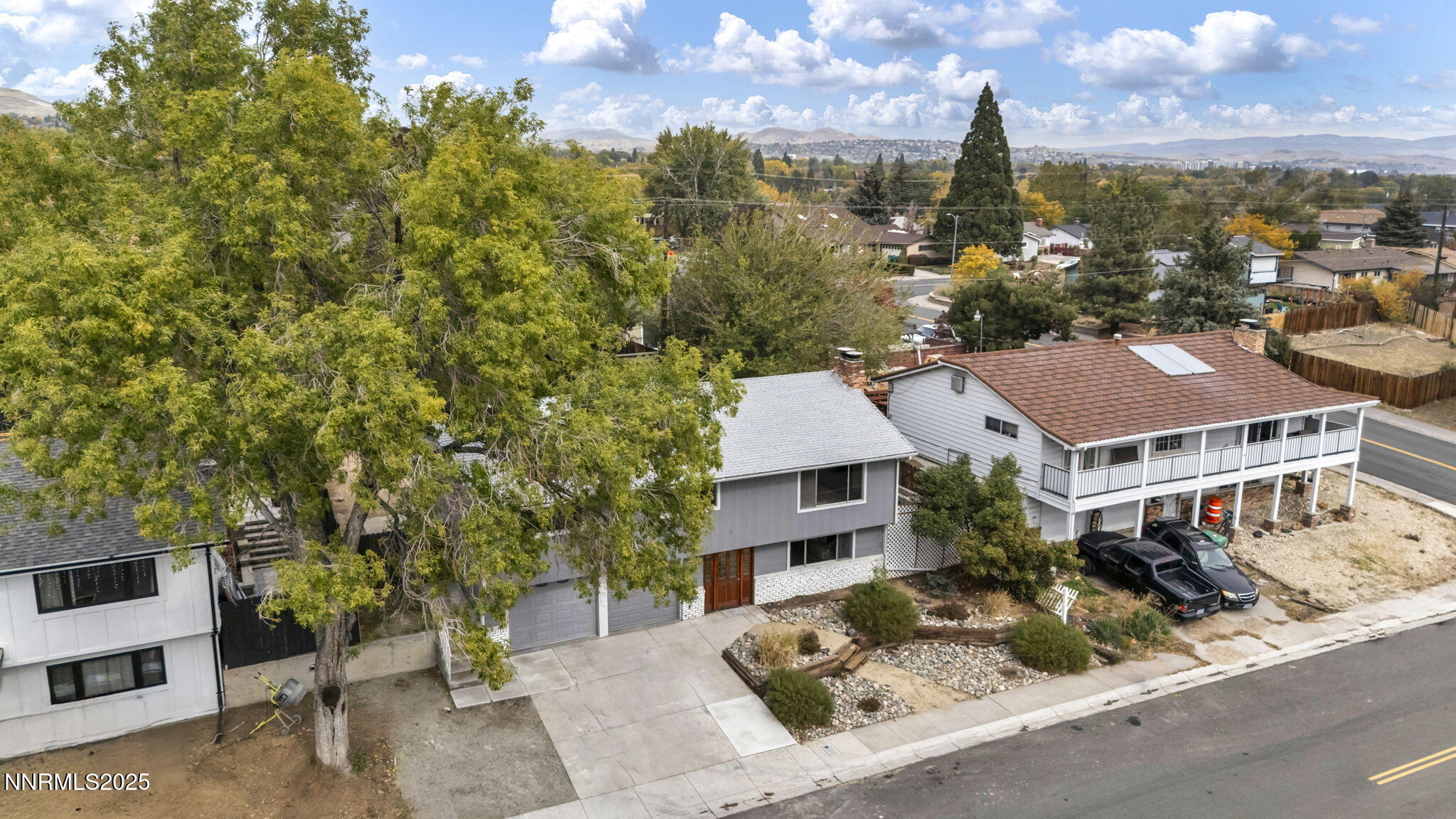 1735 Carlin Street Reno, NV 89503 - Photo 18 of 73 a aerial view of a house with a yard and table and chairs