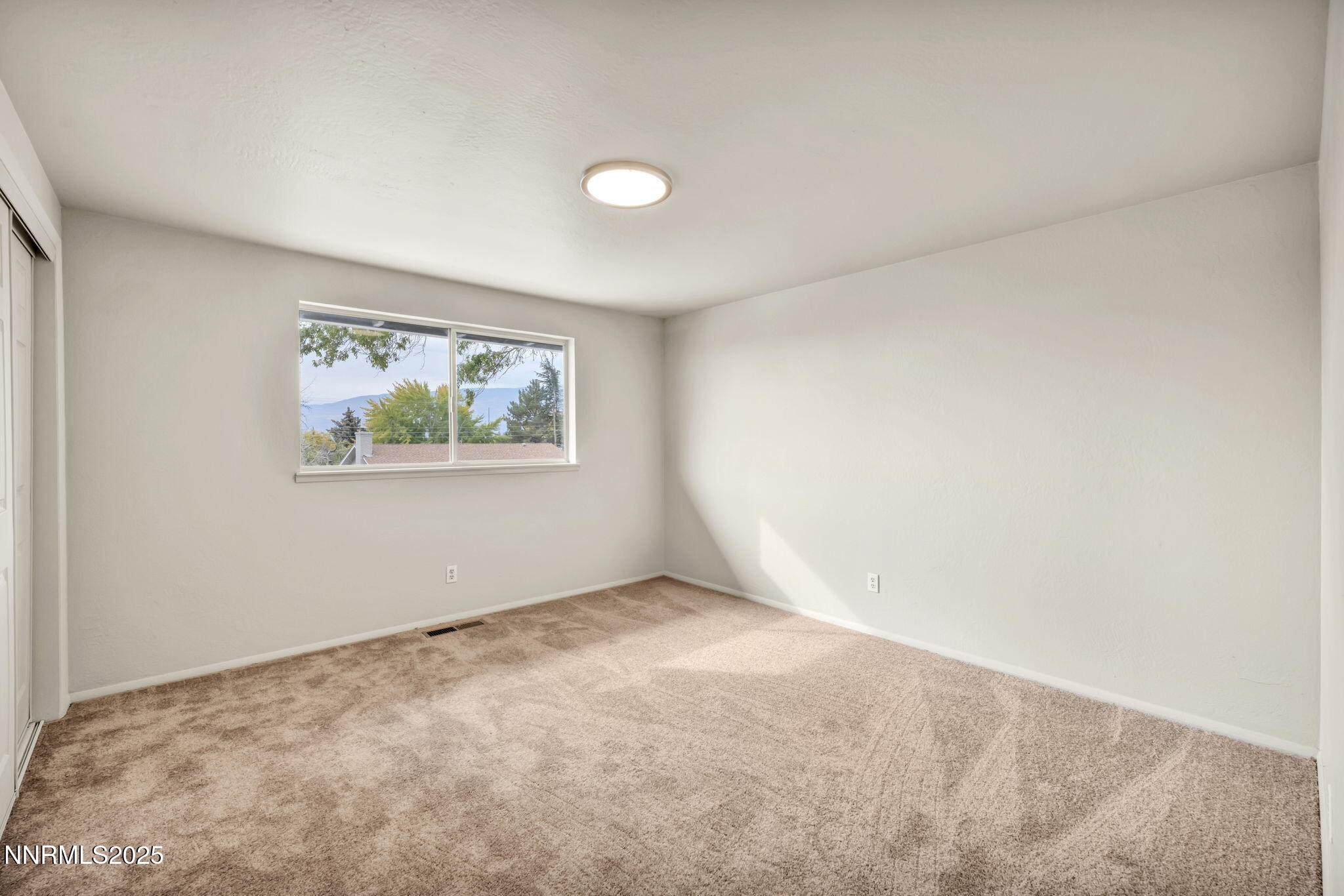 1735 Carlin Street Reno, NV 89503 - Photo 30 of 73 an empty room with a window