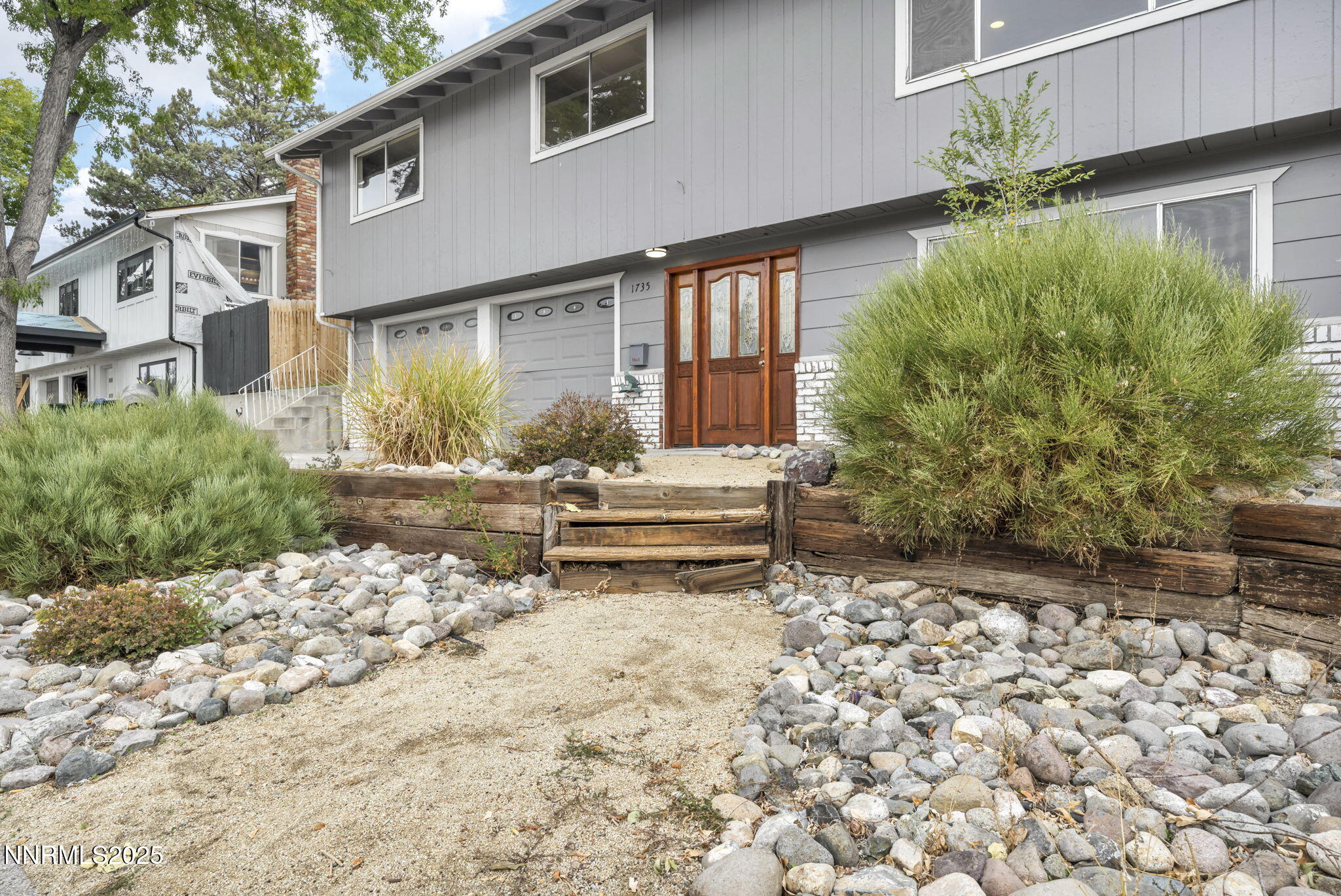 1735 Carlin Street Reno, NV 89503 - Photo 3 of 73 a backyard of a house with table and chairs and wooden fence