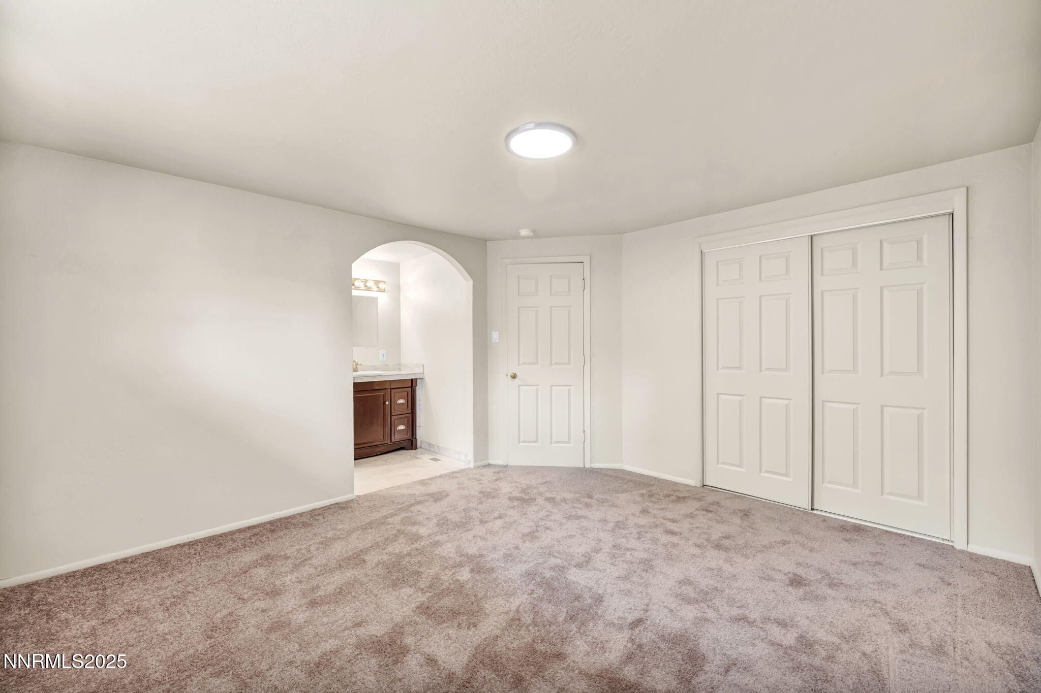1735 Carlin Street Reno, NV 89503 - Photo 33 of 73 a view of a livingroom with an empty space and a fireplace