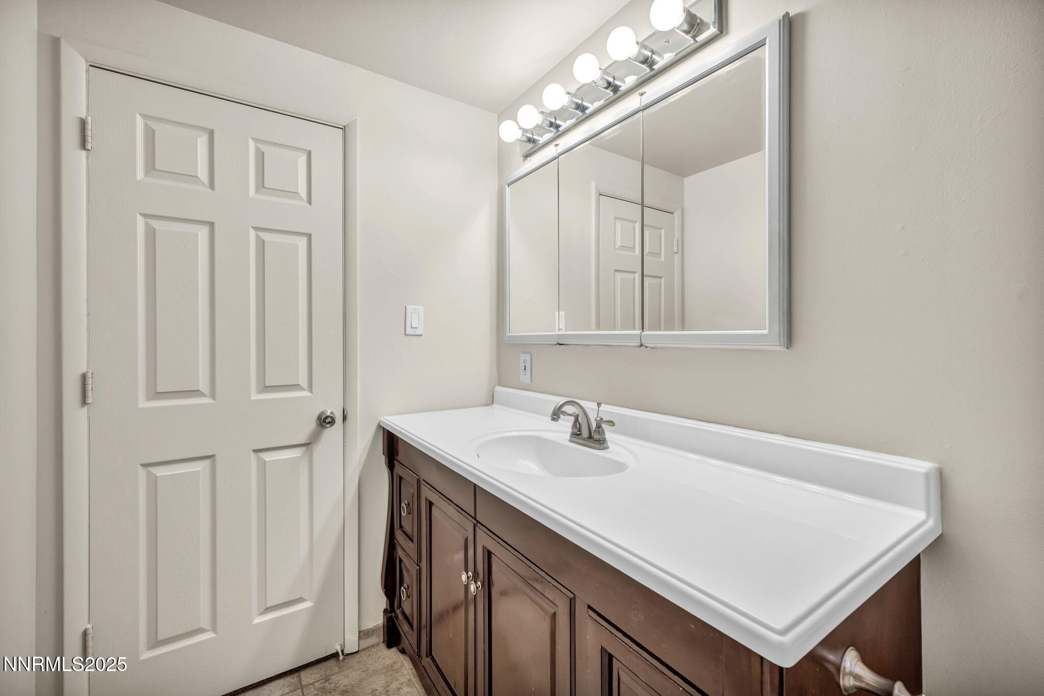 1735 Carlin Street Reno, NV 89503 - Photo 40 of 73 a bathroom with a sink a vanity and a mirror