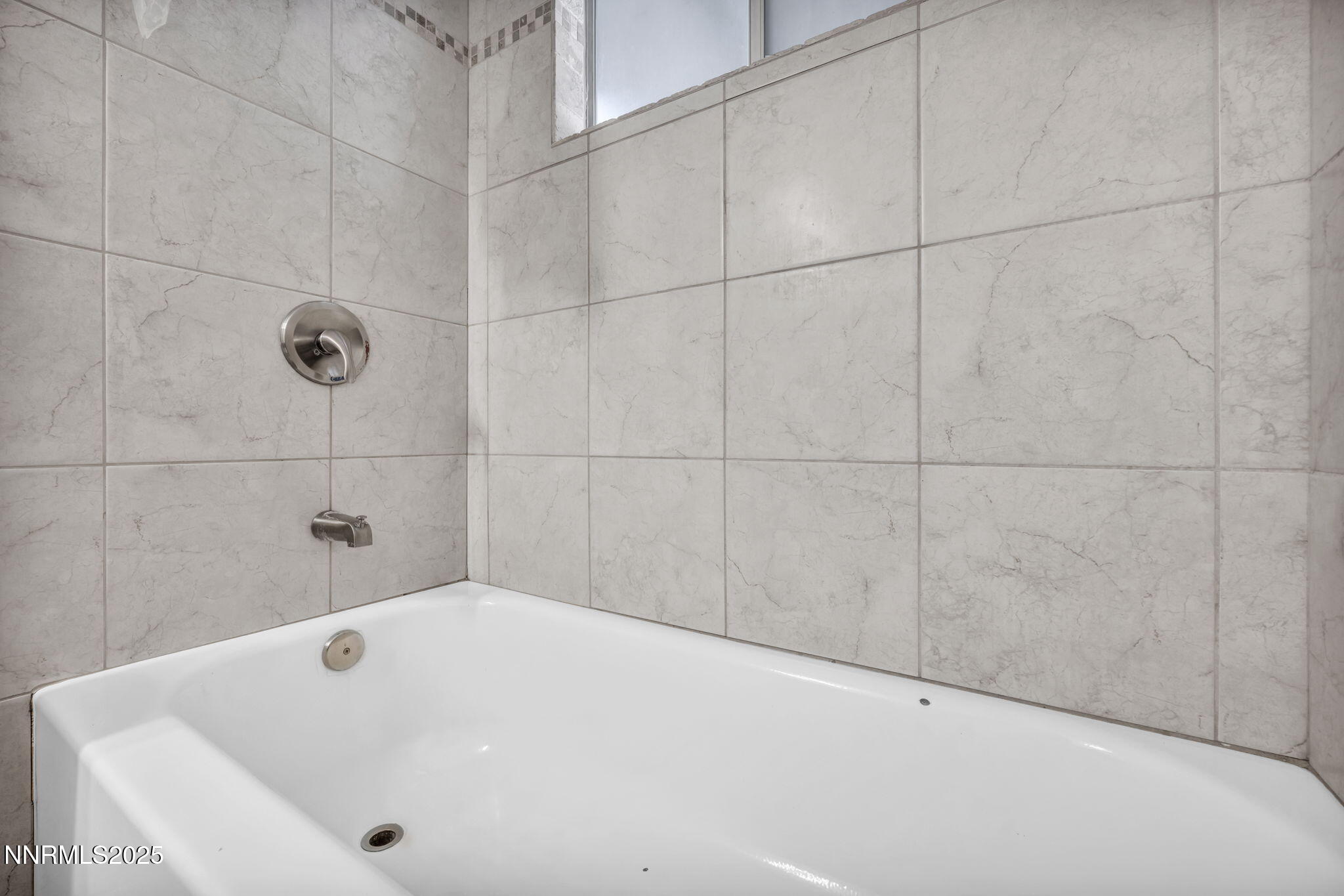 1735 Carlin Street Reno, NV 89503 - Photo 41 of 73 a bathroom with a white bath tub and shower