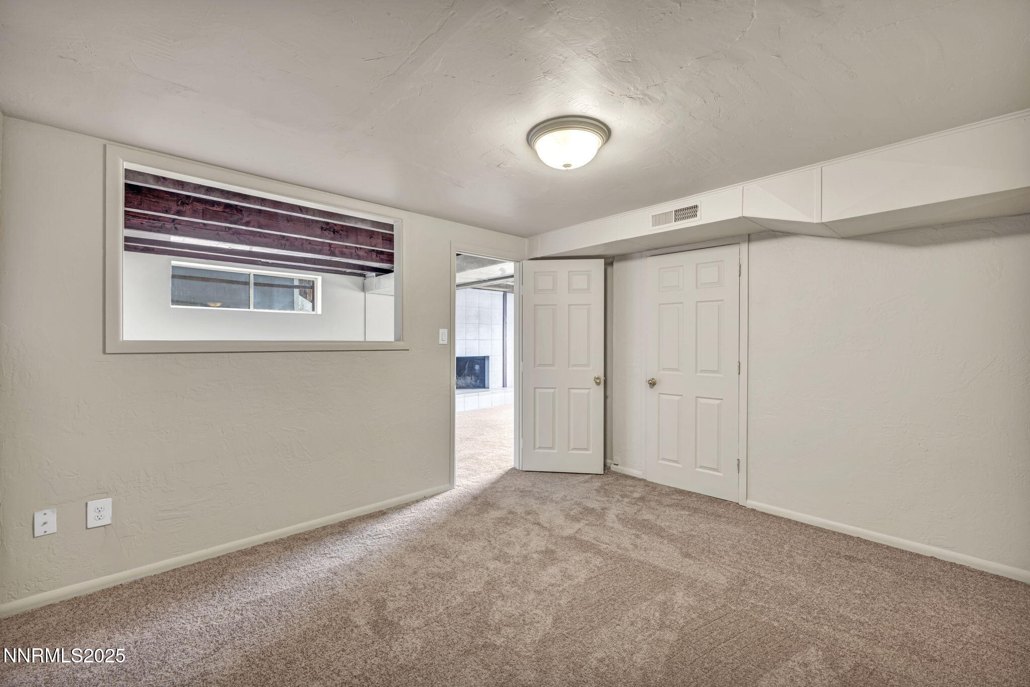 1735 Carlin Street Reno, NV 89503 - Photo 46 of 73 a view of an empty room with a window