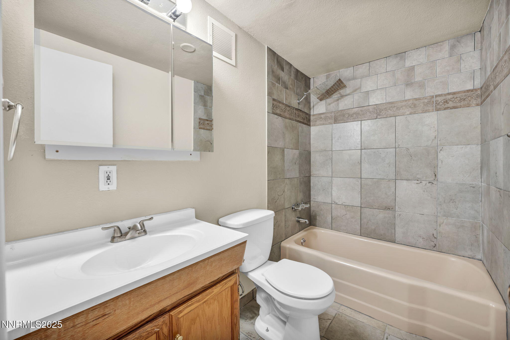 1735 Carlin Street Reno, NV 89503 - Photo 48 of 73 a bathroom with a sink a toilet and bathtub