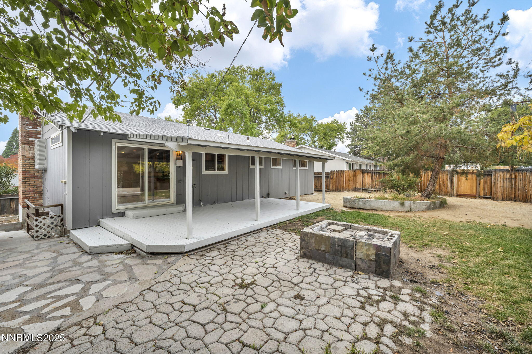 1735 Carlin Street Reno, NV 89503 - Photo 67 of 73 a front view of a house with a yard and trees