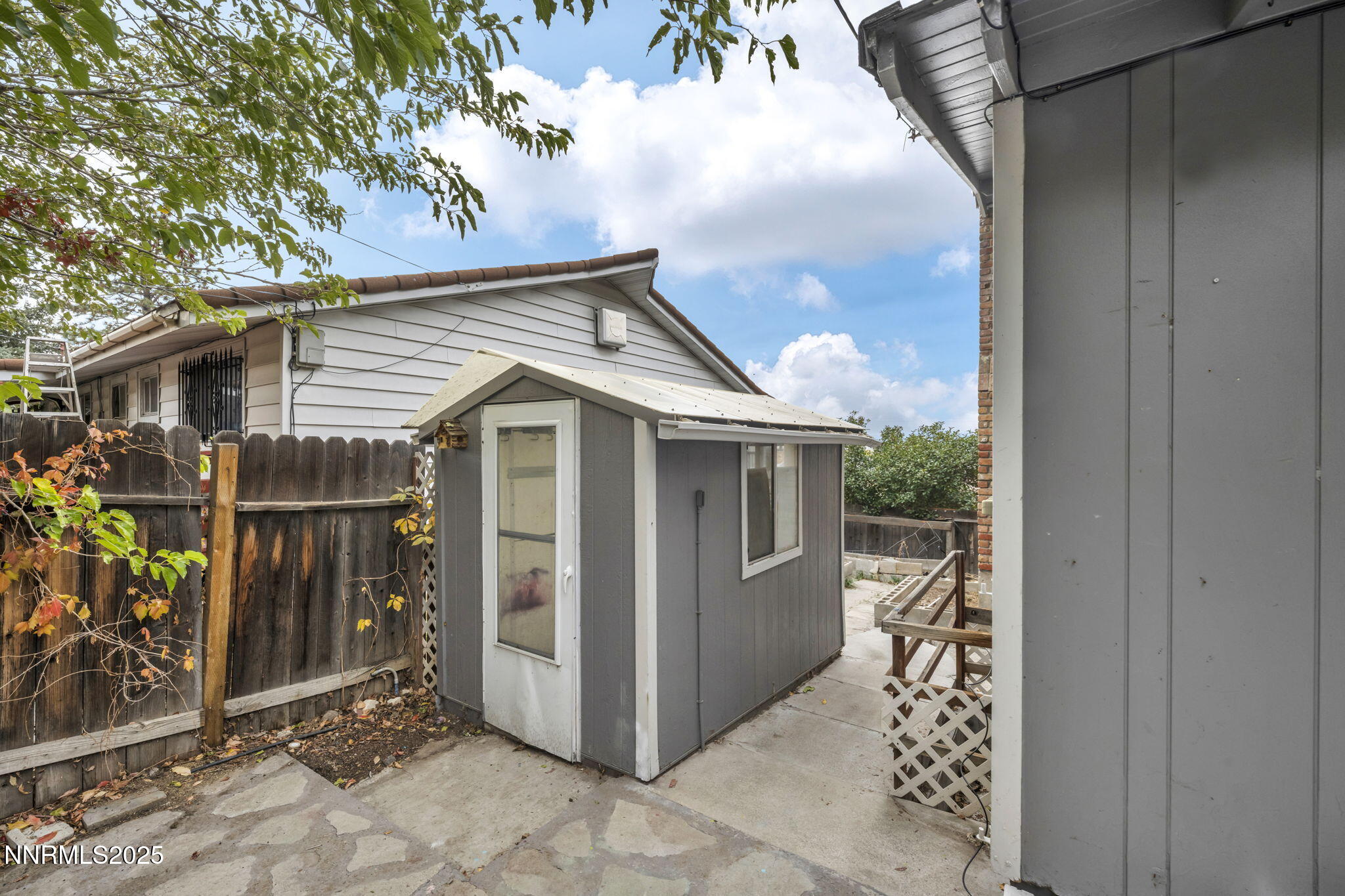 1735 Carlin Street Reno, NV 89503 - Photo 7 of 73 a view of a small house with wooden fence