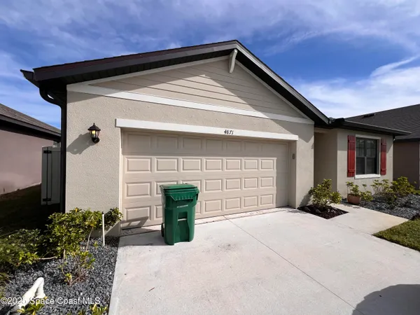 a front view of a house with a outdoor space