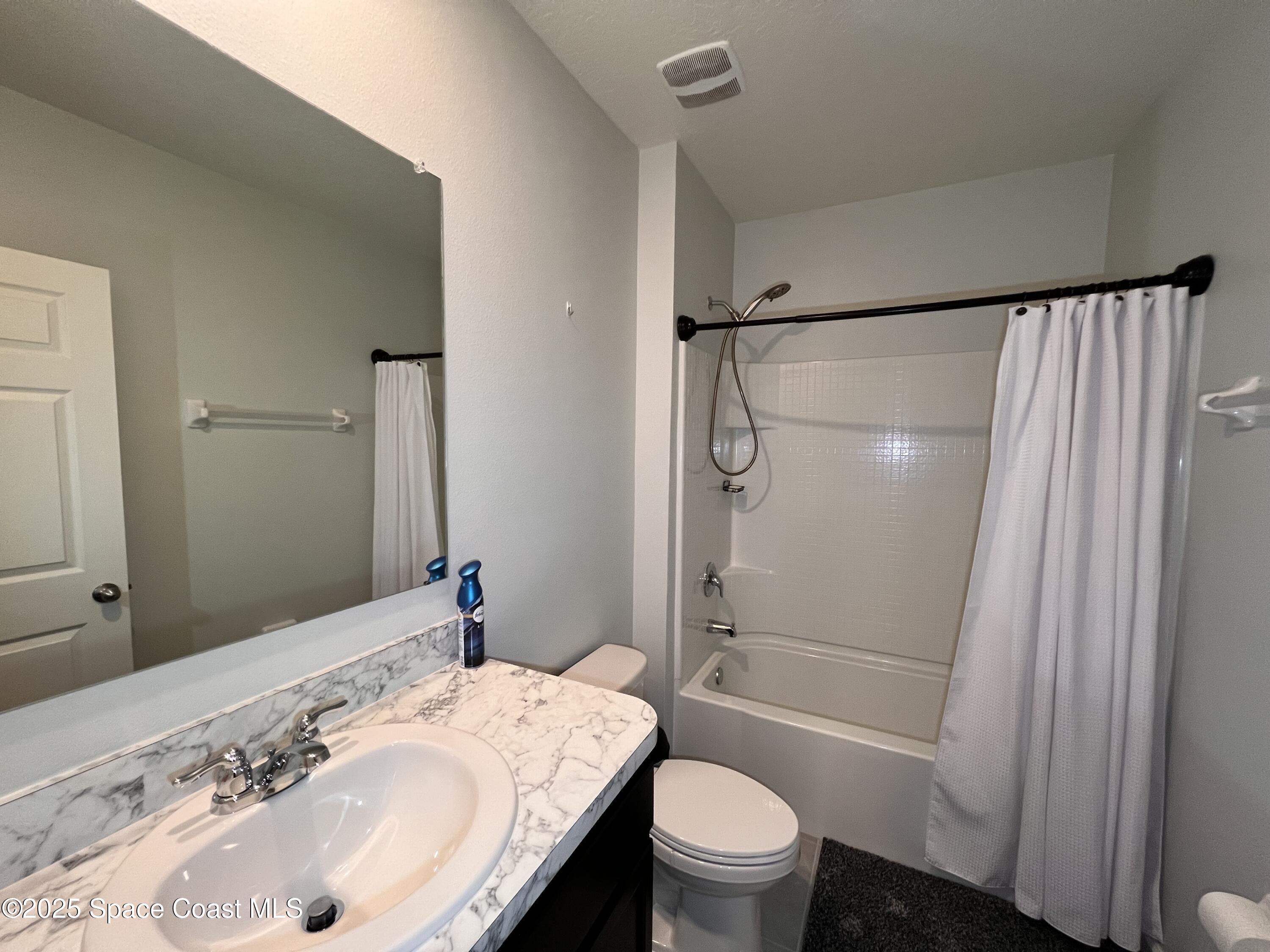 4871 Talbot Boulevard Cocoa, FL 32926 - Photo 5 of 25 a bathroom with a sink toilet and shower