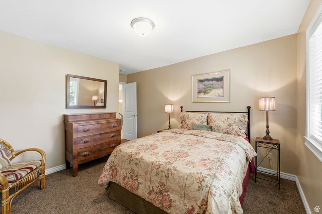7235 Viansa Court Midvale, UT 84047 - Photo 14 of 43 Bedroom with baseboards and dark colored carpet