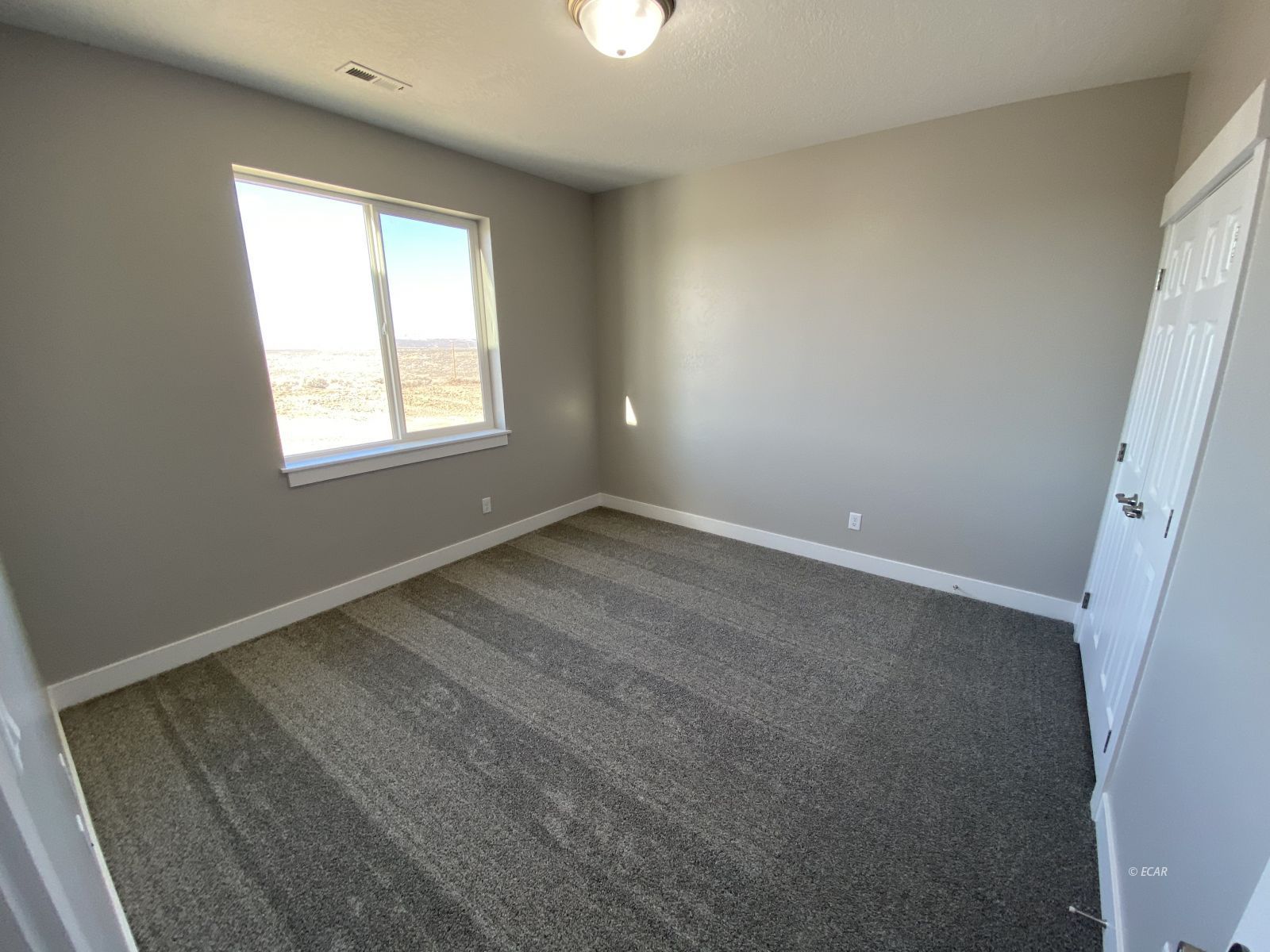 269 Sun Vly Road Spring Creek, NV 89815 - Photo 15 of 25 an empty room with a window