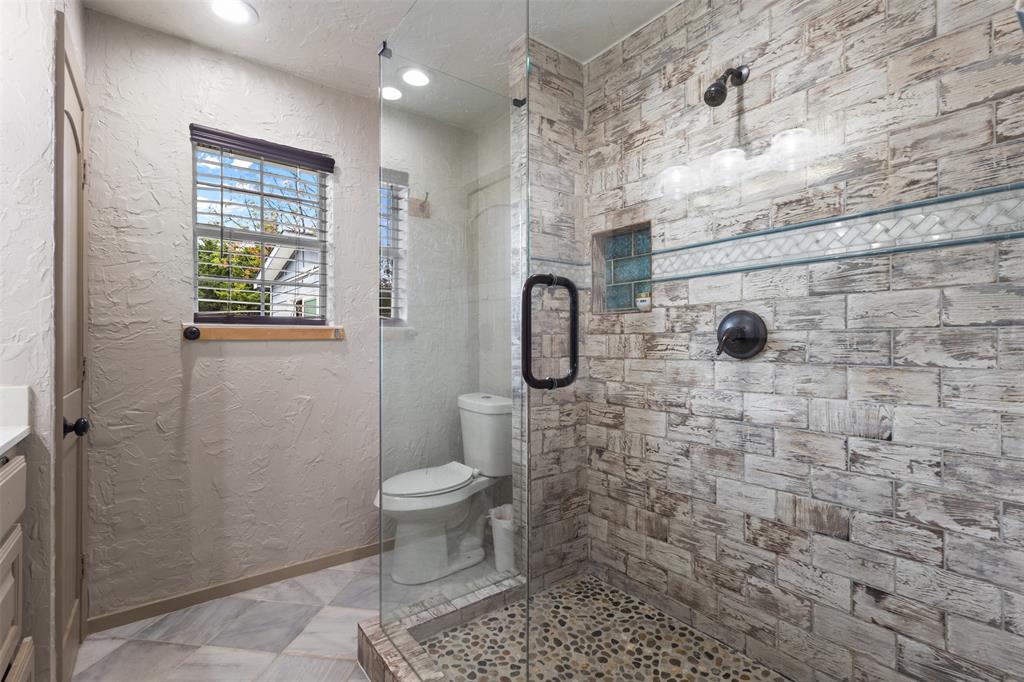 145 Lawson Road Mesquite, TX 75181 - Photo 17 of 31 a bathroom with a toilet and a shower