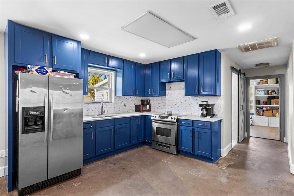 145 Lawson Road Mesquite, TX 75181 - Photo 7 of 31 a kitchen with stainless steel appliances granite countertop a refrigerator stove and oven