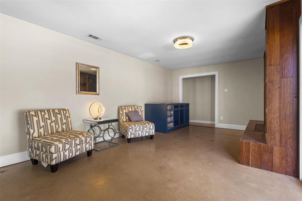 145 Lawson Road Mesquite, TX 75181 - Photo 10 of 31 a spacious bedroom with bed and a couch