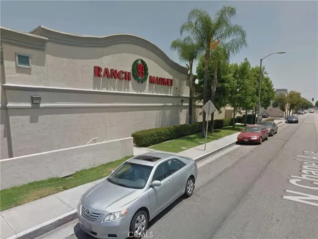a view of a patio with table and chairs and potted plants