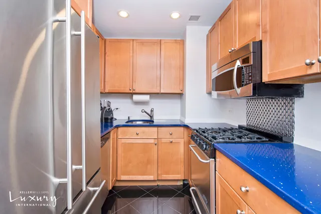 a kitchen with stainless steel appliances granite countertop a stove and a sink