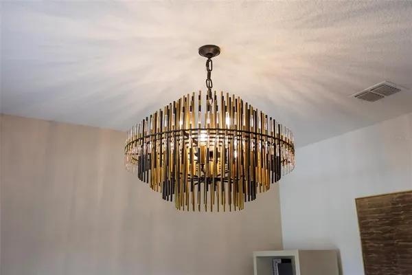 a kitchen with kitchen island granite countertop a sink a counter top space appliances and cabinets