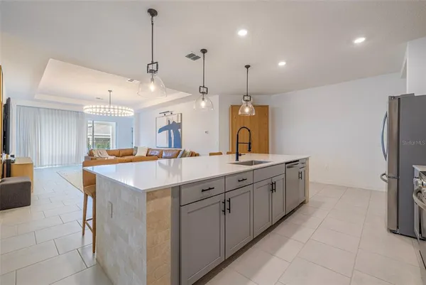 a bathroom with a double vanity sink mirror and shower
