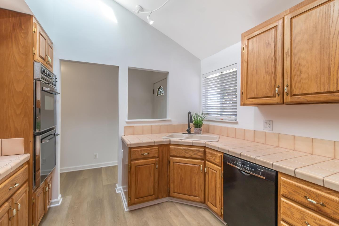 2319 Cimarron Drive Santa Clara, CA 95051 - Photo 15 of 42 a kitchen with stainless steel appliances granite countertop a sink stove and refrigerator