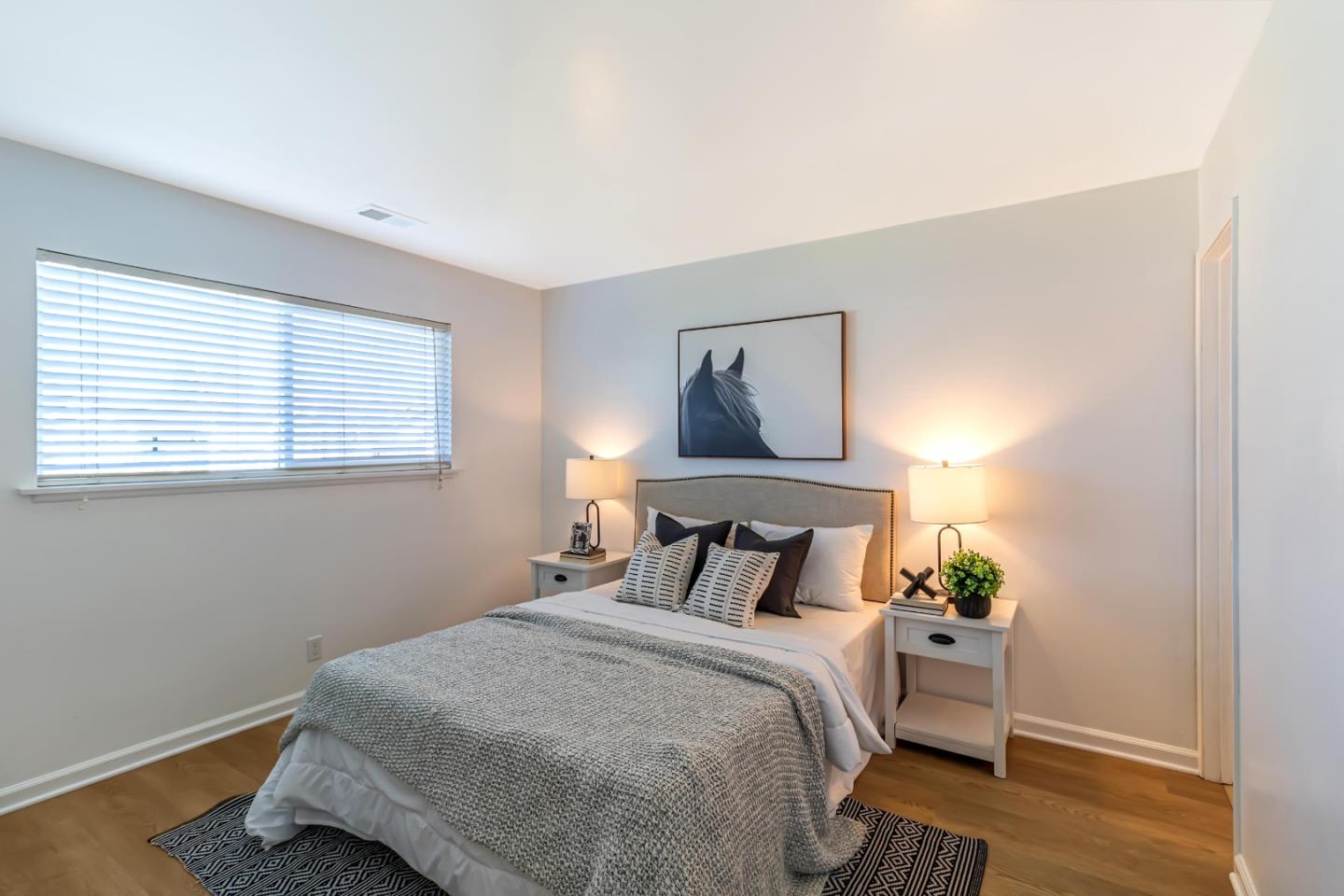 2319 Cimarron Drive Santa Clara, CA 95051 - Photo 21 of 42 a bedroom with a bed and a window