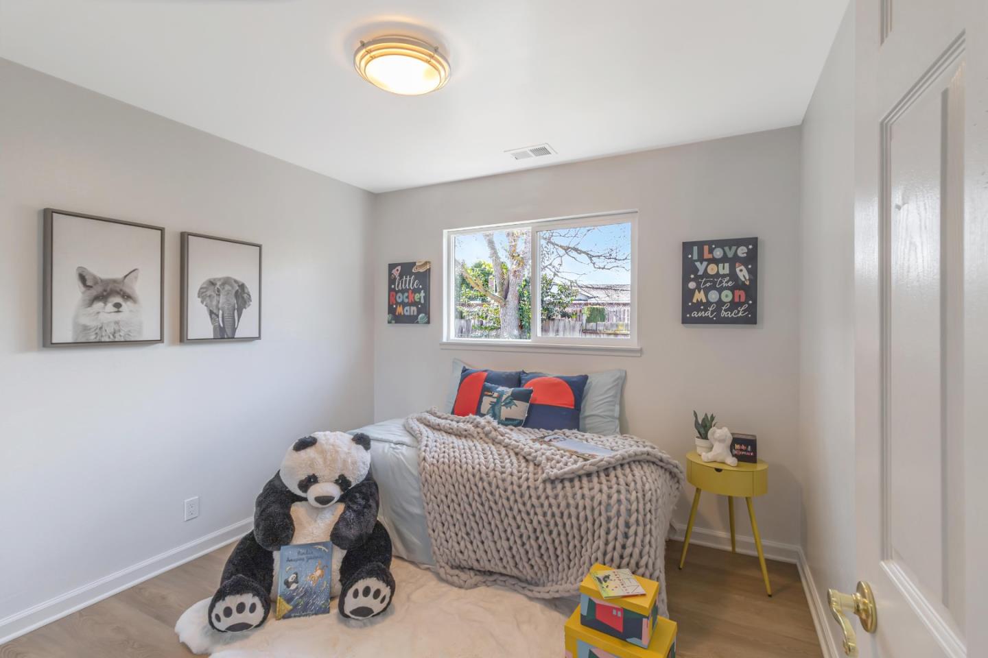 2319 Cimarron Drive Santa Clara, CA 95051 - Photo 26 of 42 a bedroom with bed and painting on the wall