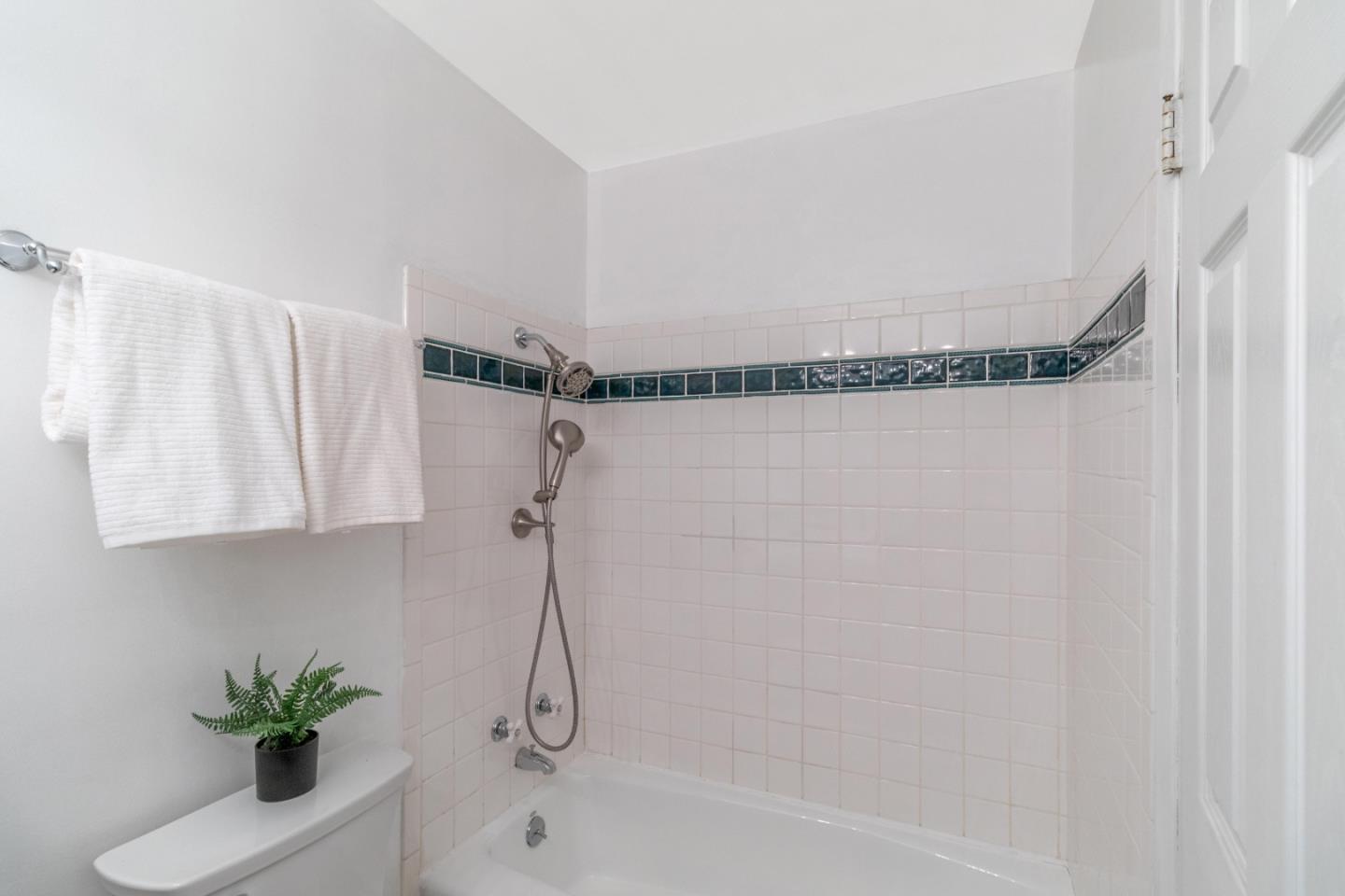 2319 Cimarron Drive Santa Clara, CA 95051 - Photo 32 of 42 a bathroom with a shower curtain and a bathtub