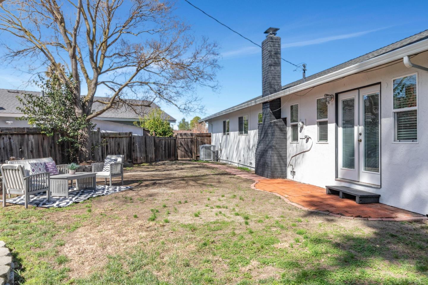 2319 Cimarron Drive Santa Clara, CA 95051 - Photo 39 of 42 a backyard of a house with table and chairs