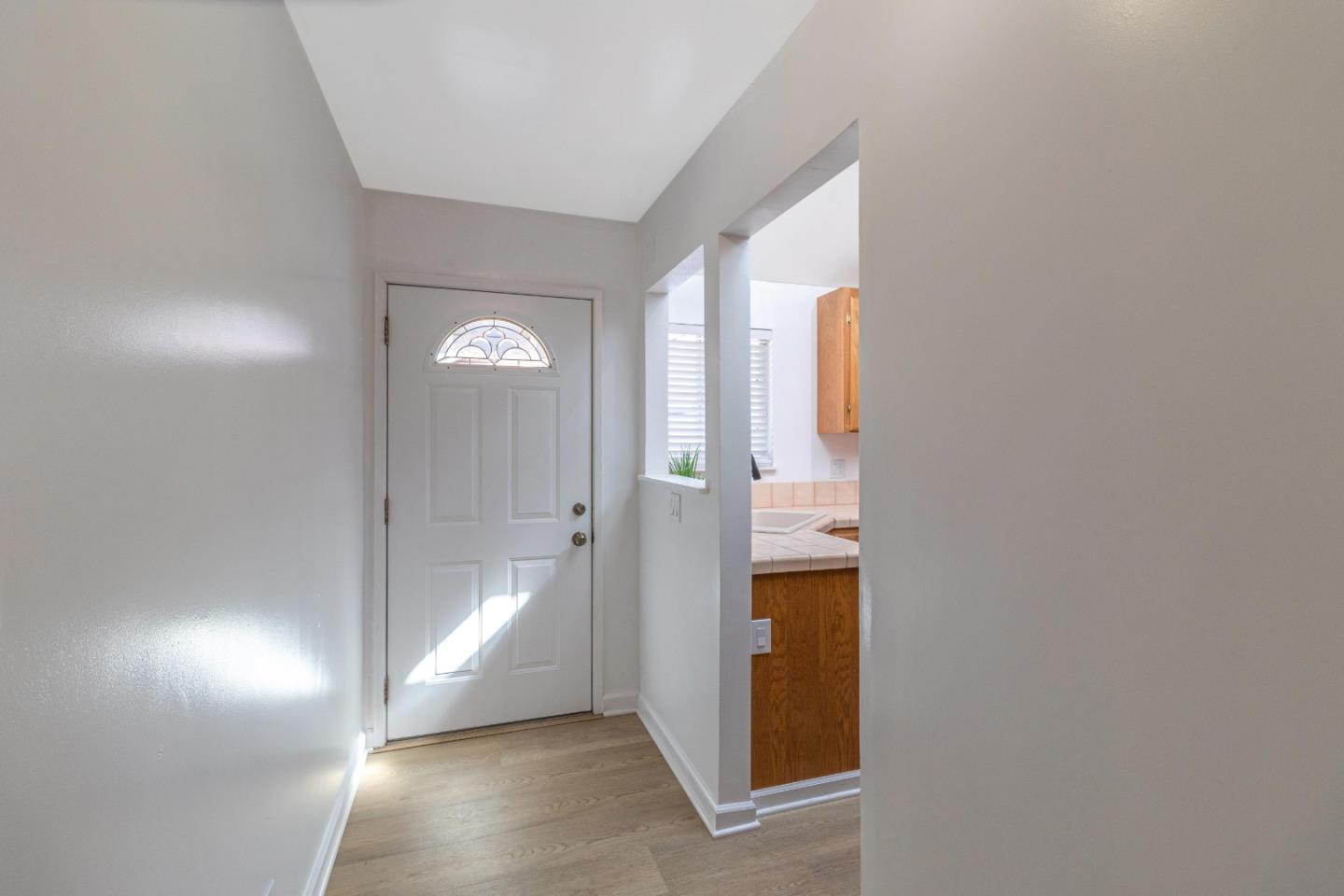 2319 Cimarron Drive Santa Clara, CA 95051 - Photo 6 of 42 a view of an entryway with wooden floor