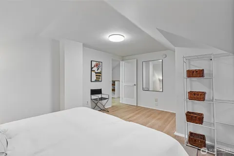 a bedroom with a bed and a desk