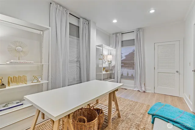 a living room with a table and chairs